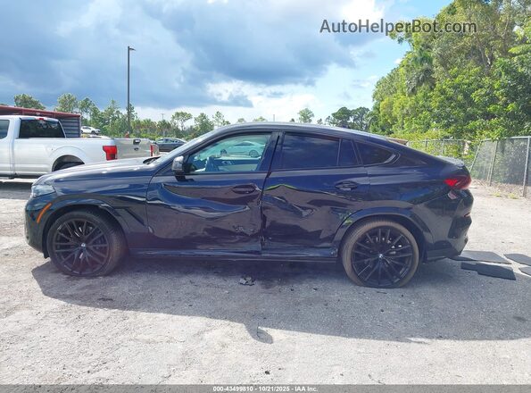 5UX33EX04R9V18045 2024 BMW X6 Black Vista interior trasera