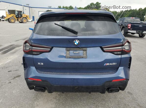 5UX83DP01P9N63411 2023 BMW X3 Синий Вид сзади