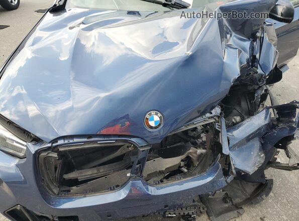 5UX83DP01P9N63411 2023 BMW X3 Синий Вид задней части салона