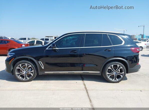 5UXCR4C08P9P71705 2023 BMW X5 Черный Вид задней части салона