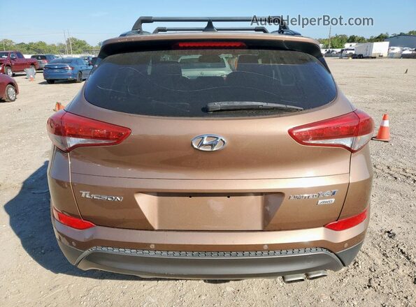 KM8J3CA27GU029538 2016 HYUNDAI TUCSON Коричневый Вид салона спереди