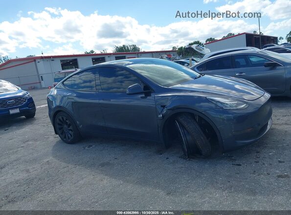 7SAYGDEE8PA044835 2023 TESLA MODEL Y Gray Widok wnętrza z tyłu