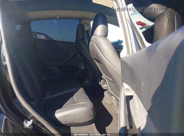 7SAYGDEF7PF908219 2023 TESLA MODEL Y Black VIN კოდის სტიკერის ხედი