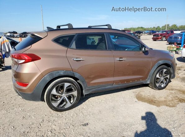 KM8J3CA27GU029538 2016 HYUNDAI TUCSON Коричневый Передняя правая четверть