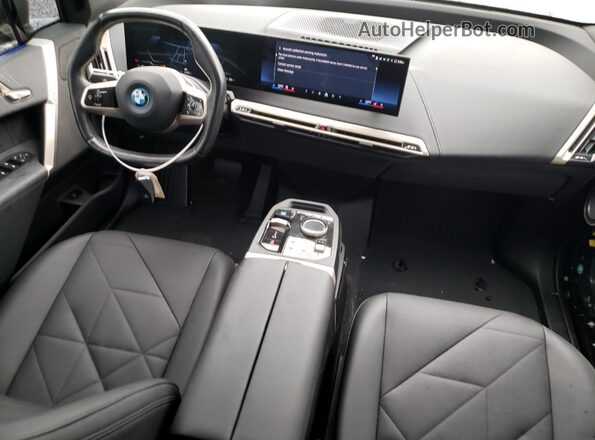 WB523CF05RCN79017 2024 BMW IX Black Widok deski rozdzielczej