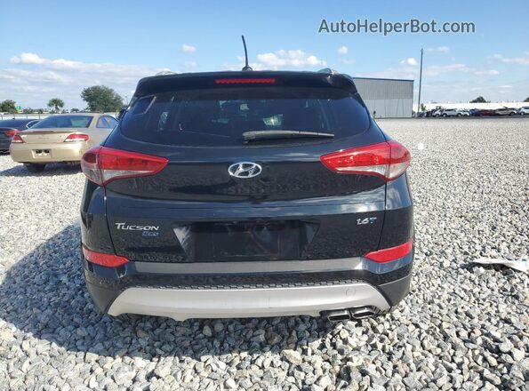 KM8J33A2XGU165002 2016 HYUNDAI TUCSON Черный Вид салона спереди