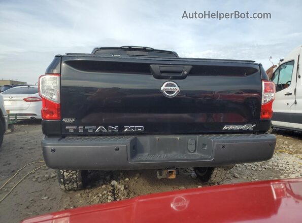 1N6BA1F45GN512286 2016 NISSAN TITAN Черный Вид салона спереди