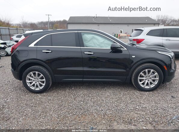 1GYFZBR40MF072587 2021 CADILLAC XT4 Черный Вид задней части салона