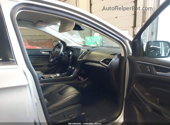 2FMPK4K90NBA38048 2022 FORD EDGE Серебряный Вид салона спереди