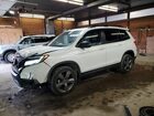 2019 Honda Passport Touring White vin: 5FNYF8H99KB027639