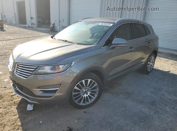 5LMCJ3C94HUL55384 2017 LINCOLN MKC Желто-коричневый Передняя левая четверть