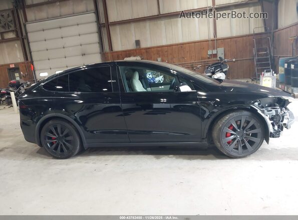 7SAXCBE66RF460974 2024 TESLA MODEL X Black Widok wnętrza z tyłu