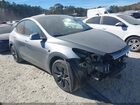 2025 Tesla Model Y Long Range Dual Motor Rear-wheel Drive Silver vin: 7SAYGDED6SA354384
