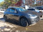 2024 Tesla Model Y Long Range Dual Motor All-wheel Drive Gray vin: 7SAYGDEE2RF166645