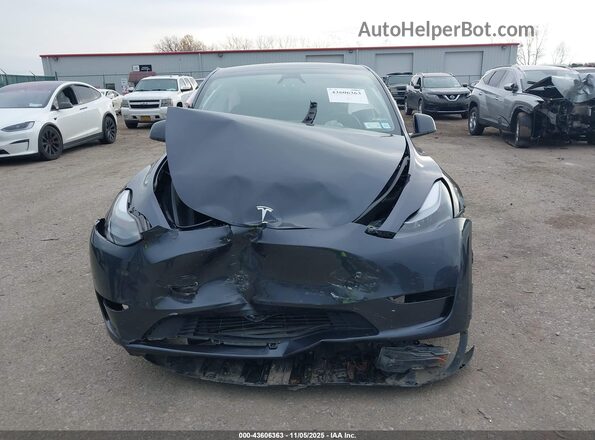 7SAYGDEF1SA336487 2025 TESLA MODEL Y Gray Առջևի վահանակի տեսք