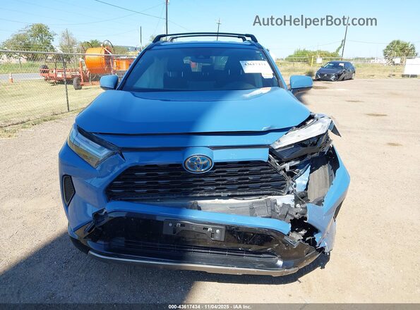 JTM16RFV7PD091796 2023 TOYOTA RAV4 HYBRID Blue Vista interior trasera