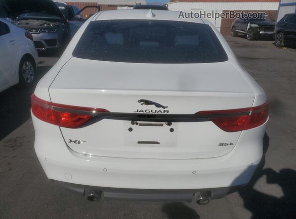 SAJBE4BV8GCY13557 2016 JAGUAR XF White Vista trasera