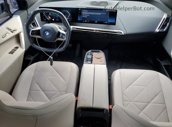 WB513CF06PCK76448 2023 BMW IX Black Vista del salpicadero