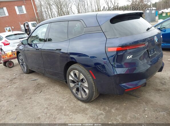 WB543CF00TCV89079 2026 BMW IX Blue Trasero izquierdo