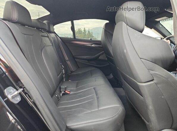 WBS83CH08PCL28431 2023 BMW M5 Black Rear seats view