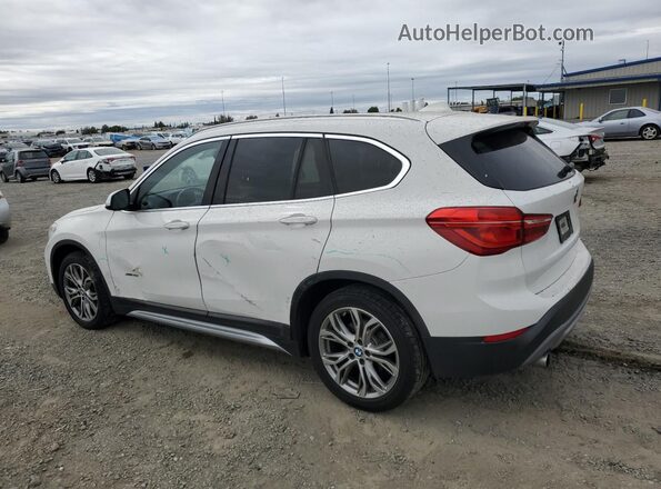 WBXHT3C32GP889552 2016 BMW X1 White Rear left
