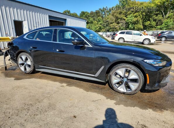 WBY43AW09RFT15359 2024 BMW I4 Угольный Передняя правая четверть