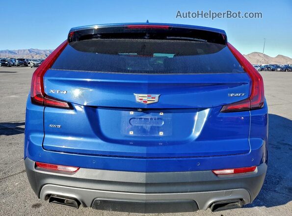 1GYFZDR41NF120725 2022 CADILLAC XT4 Blue Вид ззаду