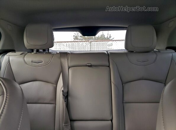 1GYFZDR43MF030233 2021 CADILLAC XT4 Blue Vista interior trasera
