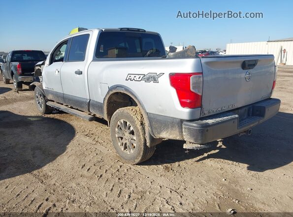 1N6AA1F47JN519517 2018 NISSAN TITAN XD Серебряный Задняя левая четверть