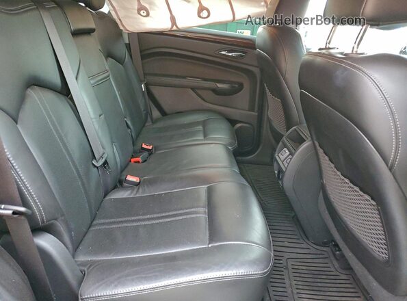 3GYFNBE31GS576090 2016 CADILLAC SRX Серебряный Вид задней части салона