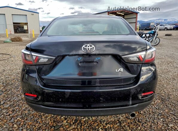 3MYDLBYV9HY180697 2017 TOYOTA YARIS Black Rear view