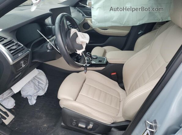5UX33DT00P9S79753 2023 BMW X4 Синий Вид салона спереди