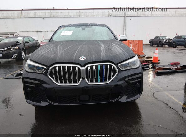 5UXCY6C00P9S03866 2023 BMW X6 Blue Vista interior trasera