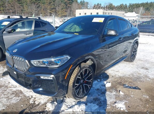 5UXCY8C01M9G02280 2021 BMW X6 Dark Blue Vista tres cuartos delantera izquierda