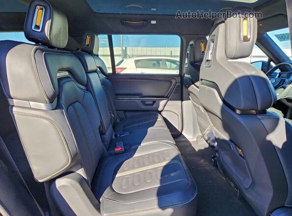 7PDSGBBA0SN052796 2025 RIVIAN R1S Угольный Вид задней части салона