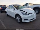 2022 Tesla Model Y Long Range Dual Motor All-wheel Drive White vin: 7SAYGAEE4NF490494