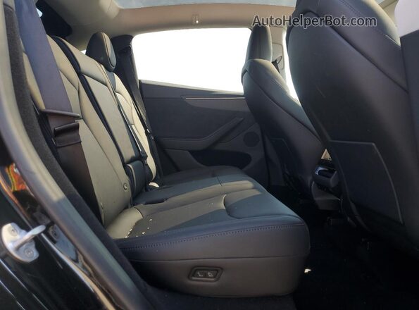 7SAYGDED8TF383535 2026 TESLA MODEL Black Vista de los asientos traseros