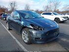 2024 Tesla Model Y Long Range Dual Motor All-wheel Drive Gray vin: 7SAYGDEE2RA233659