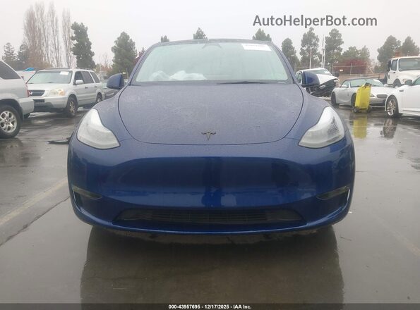 7SAYGDEE8SF238602 2025 TESLA MODEL Y Blue Սալոնի հետևի տեսք