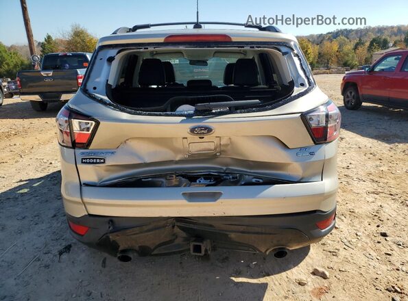 1FMCU9G99HUE04733 2017 FORD ESCAPE Золотой Вид салона спереди
