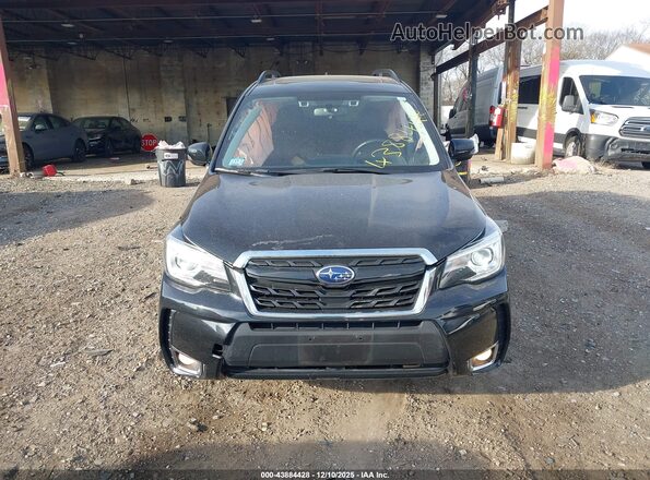 JF2SJGWC0JH574344 2018 SUBARU FORESTER2. Черный Вид задней части салона