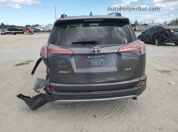 JTMWFREV3JJ184766 2018 TOYOTA RAV4 Charcoal Vista trasera