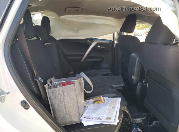 JTMWFREV7JJ724751 2018 TOYOTA RAV4 White Vista de los asientos traseros