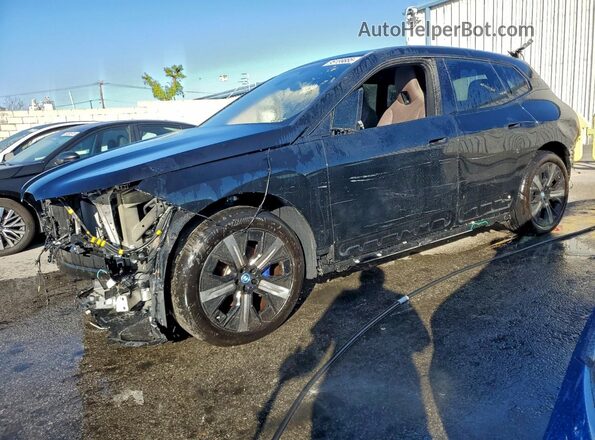 WB523CF00RCN39234 2024 BMW IX Черный Передняя левая четверть