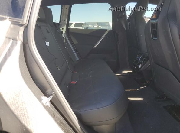 WB523CF03SCS82320 2025 BMW IX White Vista de los asientos traseros