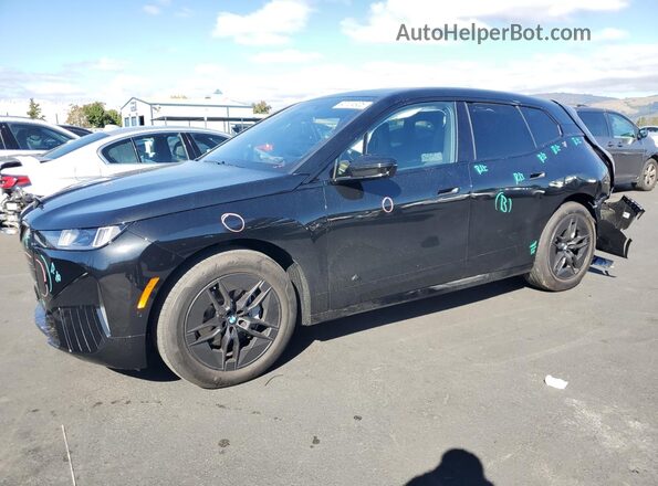 WB543CF09TCV29561 2026 BMW IX Черный Передняя левая четверть