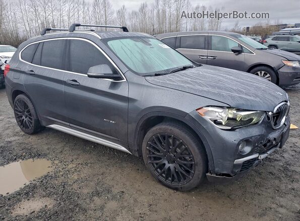 WBXHT3C37H5F74147 2017 BMW X1 Серый Передняя правая четверть