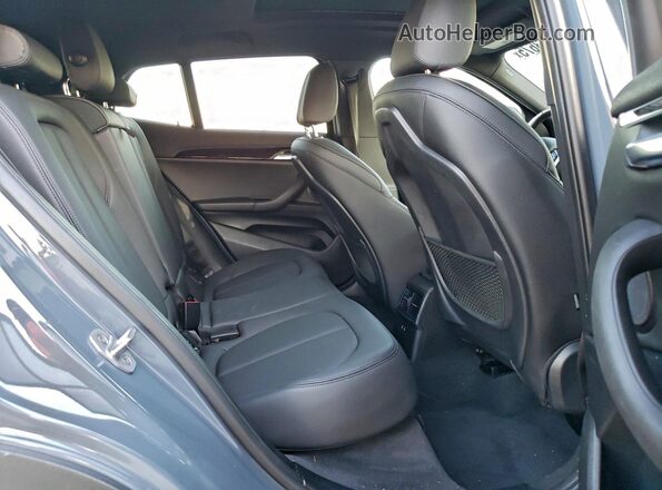 WBXYH9C05M5S06597 2021 BMW X2 Gray Vista interior trasera