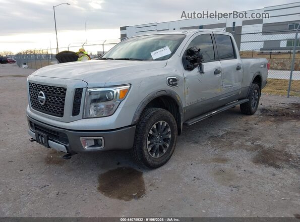 1N6BA1F40KN511684 2019 NISSAN TITAN XD Серебряный Передняя левая четверть
