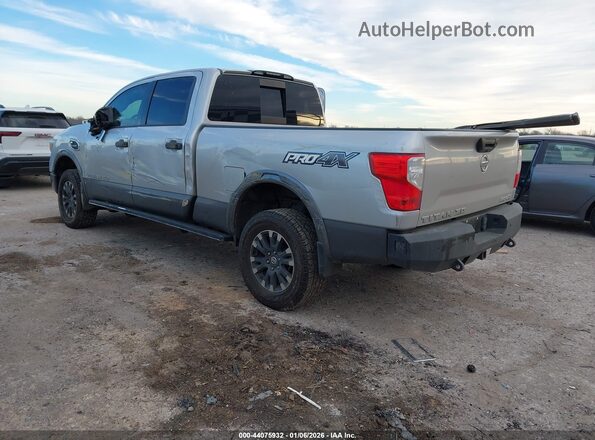 1N6BA1F40KN511684 2019 NISSAN TITAN XD Серебряный Задняя левая четверть